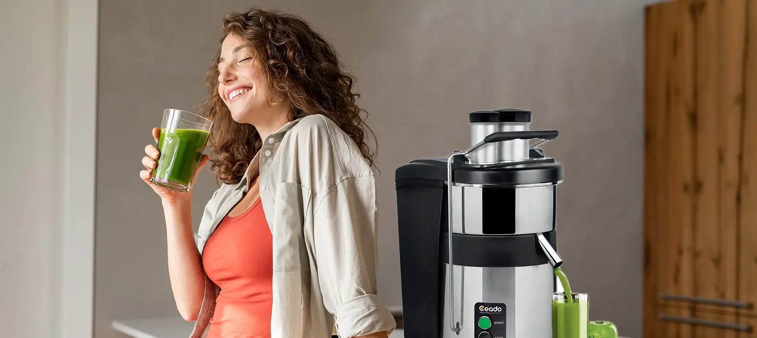 women-in-kitchen-making-juice-with-commercial-juicer-listening-to-why-most-americans-are-not-getting-enough-fruit-and-how-juice-changes-everything